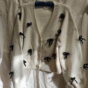 Women's Cream Cardigan Sweater with Black Bow Accents